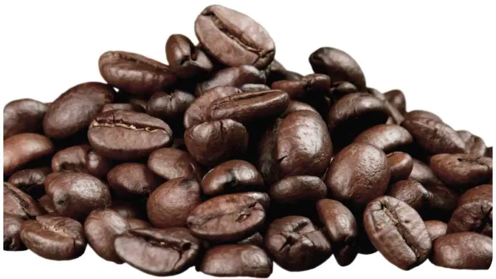 a pile of coffee beans on a black background