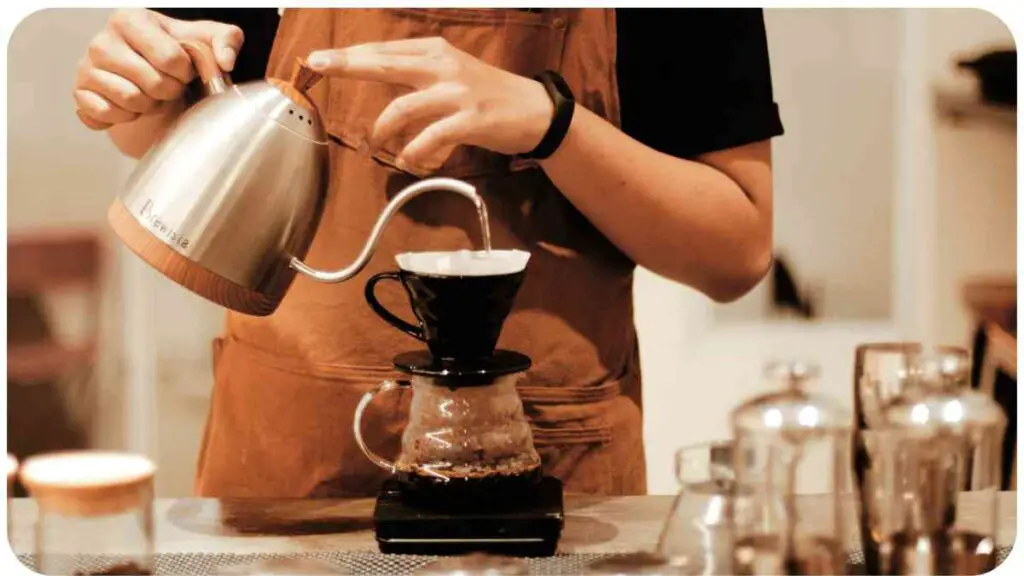a person in an apron pouring coffee into a cup